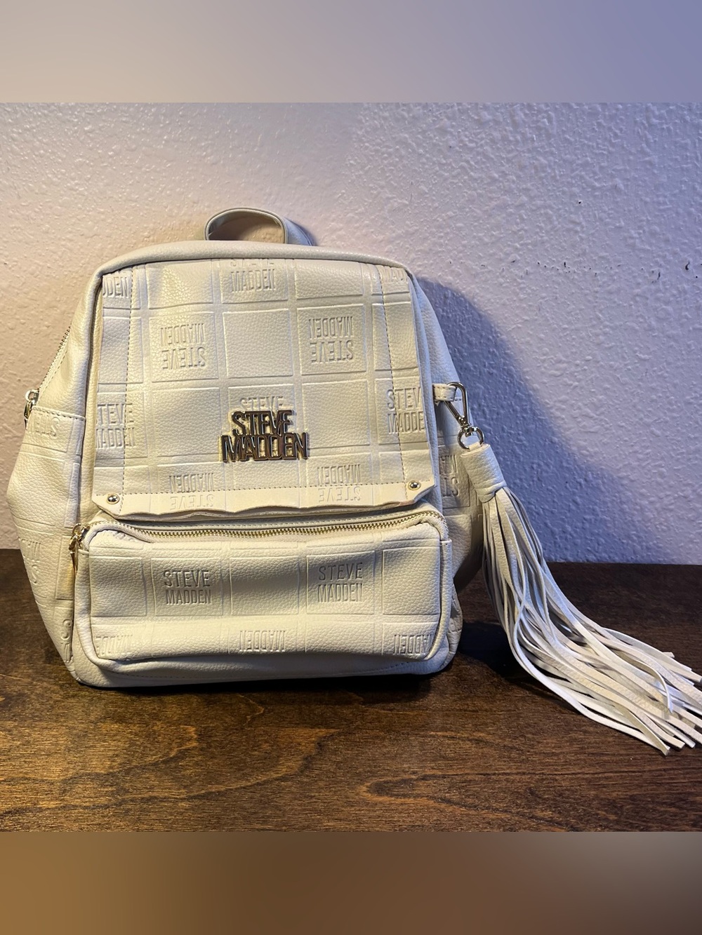 Steve Madden Mini Backpack Cream Logo Embossed Faux Leather Gold Hardware Tassel